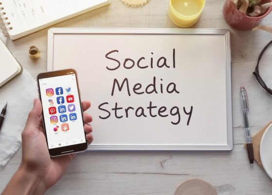 a smartphone displaying various social media app icons including Instagram, Facebook, Twitter, Pinterest, YouTube, and LinkedIn.